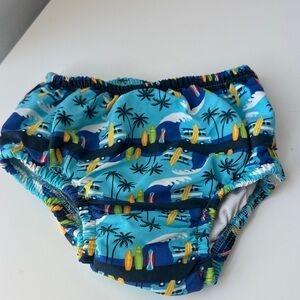 i play. Blue Surfboard and Palm Tree Swim Diaper